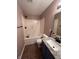 Bathroom showcases a granite vanity, tub with dark fixtures, and coordinated tile flooring at 14375 Leland Muse, Fishers, IN 46037
