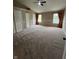 Large bedroom with plush carpet, vaulted ceiling, and natural light from multiple windows at 14375 Leland Muse, Fishers, IN 46037