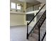 Bright living area featuring a staircase and a view of the yellow living room with a partial view of the fireplace at 14375 Leland Muse, Fishers, IN 46037