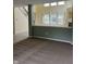 Open-concept living area with neutral carpet, light green walls, and a view of the staircase at 14375 Leland Muse, Fishers, IN 46037