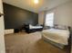Bedroom featuring carpet, two beds, and a contrasting black accent wall at 1503 Quinlan Ct, Indianapolis, IN 46217