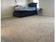 Spacious bedroom with carpet and a bed featuring storage drawers underneath at 1503 Quinlan Ct, Indianapolis, IN 46217