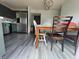 Eat-in kitchen area with stainless steel appliances and modern flooring, perfect for Gathering meals at 1503 Quinlan Ct, Indianapolis, IN 46217