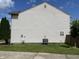The side of this home features vinyl siding and an AC unit, offering modern convenience at 1503 Quinlan Ct, Indianapolis, IN 46217