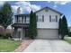 Charming two-story home features a two-car garage, brick accents, and manicured landscaping at 1503 Quinlan Ct, Indianapolis, IN 46217
