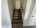 Carpeted staircase leading to the upper level, providing easy access to bedrooms at 1503 Quinlan Ct, Indianapolis, IN 46217
