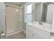 Updated bathroom features a glass shower, subway tile, modern vanity and finishes at 1504 Manhattan Ave, Indianapolis, IN 46241