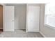 Bright bedroom featuring neutral walls, carpet, closet and natural light from the window at 1504 Manhattan Ave, Indianapolis, IN 46241