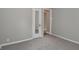 View of bedroom with neutral walls and plush carpet featuring a full length mirrored closet door and view into the hallway at 1504 Manhattan Ave, Indianapolis, IN 46241