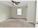 Well lit bedroom featuring neutral walls, carpet and ceiling fan with natural light at 1504 Manhattan Ave, Indianapolis, IN 46241