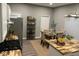 Cozy dining area features a wood table, upholstered chairs, and decorative shelving for a stylish touch at 1504 Manhattan Ave, Indianapolis, IN 46241