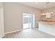 Bright kitchen features white cabinets, butcher block counters, an island, and sliding doors to the outside at 1504 Manhattan Ave, Indianapolis, IN 46241