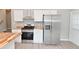 Updated kitchen featuring stainless steel appliances and butcher block countertops at 1504 Manhattan Ave, Indianapolis, IN 46241
