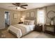 Relaxing main bedroom with a plush bed, soft lighting, neutral decor, and serene artwork at 1504 Manhattan Ave, Indianapolis, IN 46241