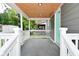 A welcoming porch with a painted door and decorative wood ceiling at 1504 Manhattan Ave, Indianapolis, IN 46241