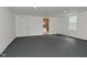 Open room featuring painted floors, ample space and natural light at 1504 Manhattan Ave, Indianapolis, IN 46241