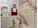 Neutral bathroom with baseball themed shower curtain, towel, and toilet seat cover adds unique character to this space at 15098 Newburyport Dr, Fortville, IN 46040