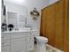 Bright bathroom featuring a white vanity, decorative shelves, and a patterned shower curtain at 15098 Newburyport Dr, Fortville, IN 46040