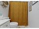 Well-lit bathroom with a decorative shower curtain, a toilet, and a stylish vanity at 15098 Newburyport Dr, Fortville, IN 46040