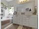 Bathroom featuring a bathtub, decorative accents, a window, and a dual sink vanity at 15098 Newburyport Dr, Fortville, IN 46040