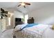 Cozy bedroom featuring neutral walls, carpet, ceiling fan and natural light from the window at 15098 Newburyport Dr, Fortville, IN 46040