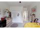 Bright bedroom with carpet, a dresser with a mirror, closet, and yellow comforter on the bed at 15098 Newburyport Dr, Fortville, IN 46040