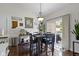 Bright dining area features stylish decor, wood floors, and sliding glass doors to the backyard at 15098 Newburyport Dr, Fortville, IN 46040