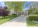 Beautiful home with lush green lawn, mature trees, and a welcoming entrance at 15098 Newburyport Dr, Fortville, IN 46040
