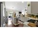 Bright kitchen features stainless steel appliances, quartz countertops, and a kitchen island at 15098 Newburyport Dr, Fortville, IN 46040