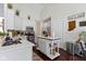This bright kitchen features white cabinets, stainless steel appliances, and an island at 15098 Newburyport Dr, Fortville, IN 46040