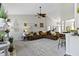 Bright living room with vaulted ceiling, comfortable sectional sofa, stylish decor, and seamless access to the dining area at 15098 Newburyport Dr, Fortville, IN 46040