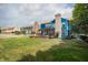 Spacious backyard with wooden pergola and deck, green lawn, and fenced perimeter at 1521 Midnight Pass, Brownsburg, IN 46112