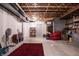 Unfinished basement featuring exposed wood ceiling, concrete floors, and white painted walls at 1521 Midnight Pass, Brownsburg, IN 46112