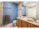 Bathroom with a blue accent wall, a toilet, and a double sink vanity at 1521 Midnight Pass, Brownsburg, IN 46112