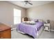 Bright bedroom with a ceiling fan and a window bringing in the natural light at 1521 Midnight Pass, Brownsburg, IN 46112