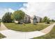Charming two-story home with a well-manicured lawn, sidewalk and two-car garage at 1521 Midnight Pass, Brownsburg, IN 46112