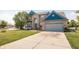 Charming two-story home with attached garage, lovely lawn, and concrete driveway at 1521 Midnight Pass, Brownsburg, IN 46112