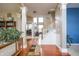 Spacious foyer with hardwood flooring, white columns, and staircase leading to the upper level at 1521 Midnight Pass, Brownsburg, IN 46112