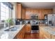 Close up on the kitchen, featuring stainless steel appliances, granite countertops and a stainless sink at 1521 Midnight Pass, Brownsburg, IN 46112