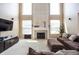 Inviting living room boasts a fireplace, two-story ceilings, and a comfortable sectional sofa at 1521 Midnight Pass, Brownsburg, IN 46112