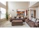 Open living room with high ceilings, comfortable seating, and view to the kitchen at 1521 Midnight Pass, Brownsburg, IN 46112
