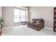Living room featuring neutral walls, a large armchair, and a window at 1521 Midnight Pass, Brownsburg, IN 46112