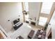 Elevated view of the living room with fireplace, soaring ceilings, and comfortable brown sectional at 1521 Midnight Pass, Brownsburg, IN 46112