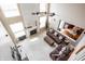 Aerial view showcasing the living room's fireplace, high ceilings, and connection to the kitchen at 1521 Midnight Pass, Brownsburg, IN 46112