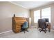 Home office featuring carpet, wooden desk, filing cabinet, and neutral paint at 1521 Midnight Pass, Brownsburg, IN 46112