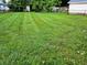 Large, mowed backyard featuring lush, green grass at 160 E Elm St, Morgantown, IN 46160