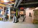 Basement storage area with shelves, boxes, suitcase, and exposed ductwork, and concrete floor at 160 E Elm St, Morgantown, IN 46160