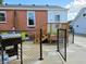 Back exterior of the home showing wood stairs to door and the lawn at 160 E Elm St, Morgantown, IN 46160