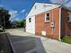 Exterior view of the brick house with long driveway, showing the side and back of the property at 160 E Elm St, Morgantown, IN 46160