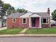 Quaint brick home featuring a classic design and a well-manicured front lawn at 160 E Elm St, Morgantown, IN 46160